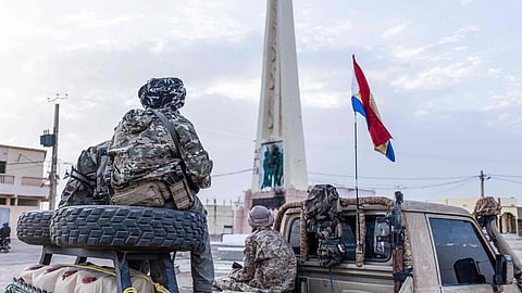 Soldiers from the National Front for the Liberation of Azawad (FLA) sit on a pick-up truck as they patrol the streets of Kidal, on May 8, 2026. Mali's government refuses to talk to "terrorist" armed groups, the foreign minister has said, days after jihadists and allied separatists mounted unprecedented attacks against the junta. 