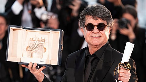  Director Jafar Panahi, winner of the Palme d'Or for the film "It Was Just an Accident," appears at the awards ceremony photo call at the 78th international film festival, Cannes, southern France, on May 24, 2025.