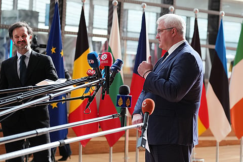 Ukraine's Foreign Minister Andrii Sybiha, right, speaks with the media as he arrives for a meeting of EU foreign ministers at the European Council building in Brussels, Monday, May 11, 2026. 