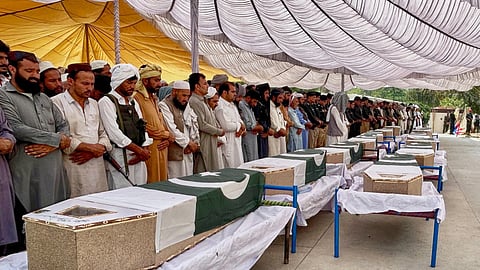 People offer funeral prayers for the police officers who were killed in the overnight suicide bombing at a security post in Fatah Khel, in Bannu, a district in Pakistan's Khyber Pakhtunkhwa province bordering Afghanistan, Sunday, May 10, 2026.