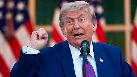 President Donald Trump speaks at a dinner for members of his administration and law enforcement organization leaders, during National Police Week, in the White House Rose Garden, Monday, May 11, 2026, in Washington.
