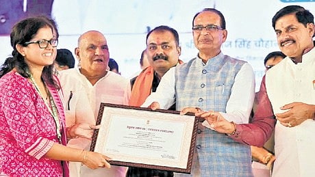 Union Rural Development minister Shivraj Singh Chouhan presenting the award to an officer of Odisha government for performance in PMGSY implementation, in presence of MP CM Mohan Yadav  