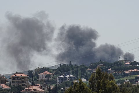 This photograph taken from the southern area of Nabatieh shows smoke rising from the site of an Israeli airstrike that targeted the village of Zebdine on May 11, 2026.