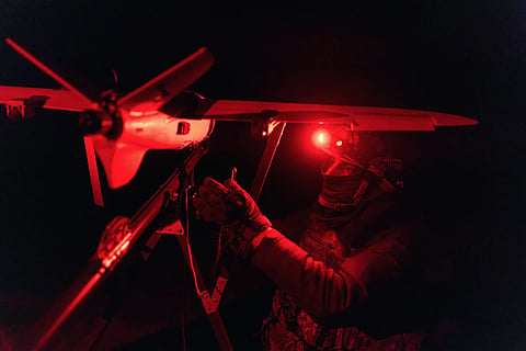 A Ukrainian soldier launching a drone at the front line in the Kharkiv region. In the wake of recent military operation being dominated by aerial systems, India needs a whole lot of unmanned combat systems for all three domains