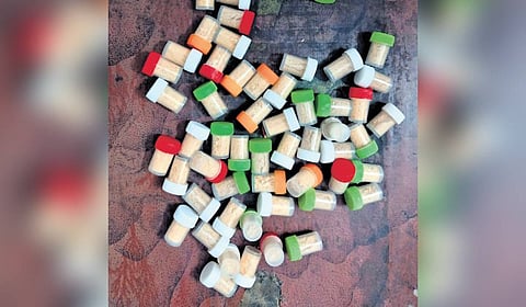Heroin bottles seized by authorities from migrant workers in Ernakulam district.