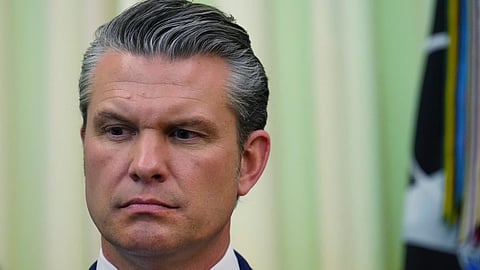 Defense Secretary Pete Hegseth listens as President Donald Trump speaks before signing a proclamation in the Oval office at the White House, Tuesday, May 5, 2026.