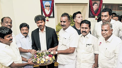 Tamil Nadu Chief Minister Vijay with AIADMK leaders C Ve Shanmugam, S P Velumani and others during a meeting in Chennai on Tuesday.