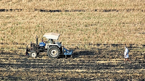 A tractor ploughs a field near Vijayawada as farmers begin pre-sowing operations amid forecasts of an early monsoon and advance water release.