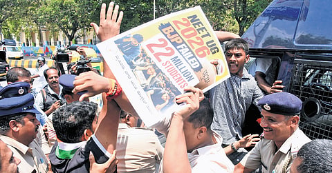 The police detain Youth Congress members who tried to lay siege to Mysuru-Kodagu MP Yaduveer Krishnadatta Chamaraja Wadiyar’s office over NEET paper leak in Mysuru on Wednesday