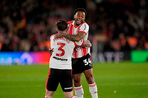 Southampton's Welington, right, and Ryan Manning celebrate at the final whistle in the EFL Championship play off semifinal soccer game between Southampton and Middlesbrough, Tuesday, May 12, 2026, in, Southampton, England