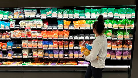 A shopper peruses cheese offerings at a Target store Wednesday, Oct. 4, 2023, in Sheridan, Colo