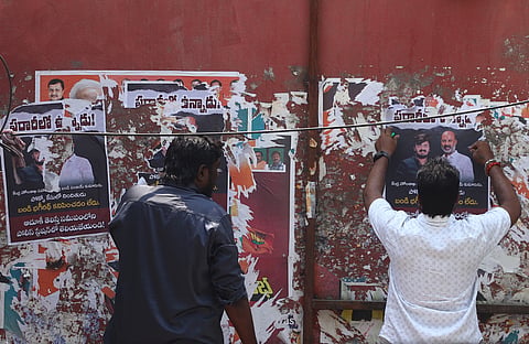 BJP workers remove the posters declaring Bandi Sanjay's son and POCSO case accused Bandi Bhageerath as 'absconding'