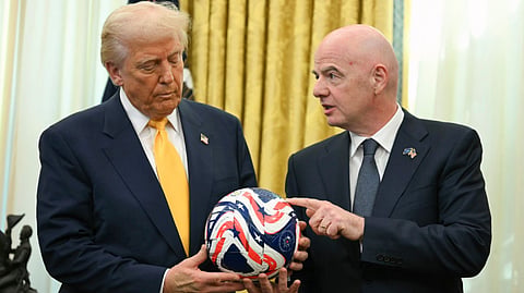 FIFA President Gianni Infantino, right, presents President Donald Trump with the new FIFA Club World Cup official ball in the Oval Office of the White House in Washington, March 7, 2025.