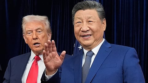 Chinese President Xi Jinping, right, waves, with President Donald Trump, ahead of their summit talk at Gimhae International Airport in Busan, South Korea, Thursday, Oct. 30, 2025. 