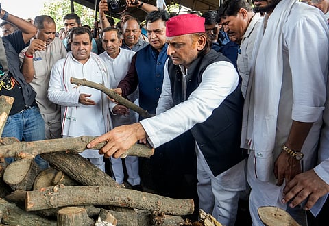 Samajwadi Party chief Akhilesh Yadav performs the last rites of his brother Prateek Yadav, in Lucknow, Thursday, May 14, 2026. Samajwadi Party MP Dharmendra Yadav and others are also seen.