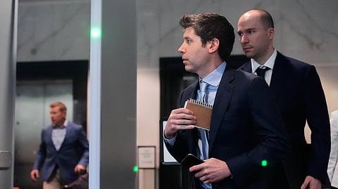 Sam Altman, center, and OpenAI president Greg Brockman, right, arrive at the US District Court in Oakland, Calif., Thursday, April 30, 2026.