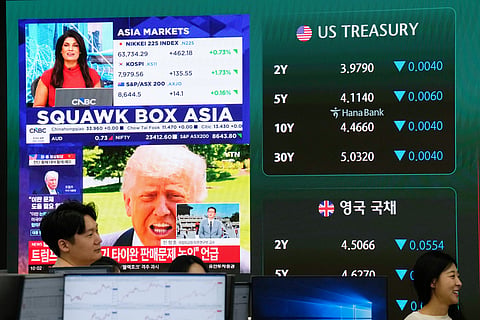 Asia markets index of Japan, South Korea and Australia is seen on a screen at the foreign exchange dealing room of the Hana Bank headquarters in Seoul, South Korea, Thursday, May 14, 2026. 
