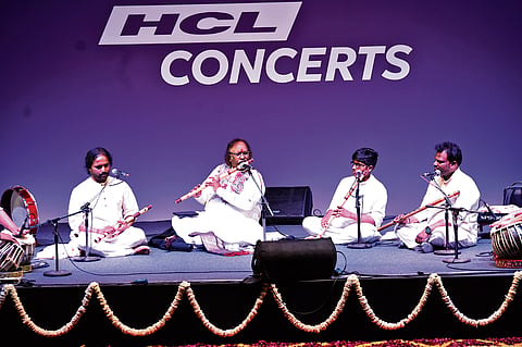 Rajendra Prasanna with his sons, Rajesh and Ritesh, and grandson Rishal