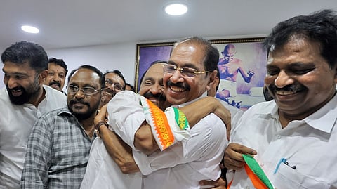 Chief Minister-designate VD Satheesan shares a light moment with KPCC President Sunny Joseph 