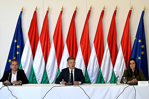Hungarian Prime Minister Péter Magyar, centre, attends the first, out-of-town cabinet meeting of the new Tisza government flanked by Balint Ruff, Head of the Prime Minister's Office, and Foreign Minister Anita Orban, right, in the Opusztaszer National Historical Memorial Park in Opusztaszer, Hungary, Wednesday, May 13, 2026. 
