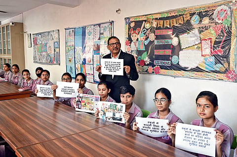 Virender Punj with students in a classroom