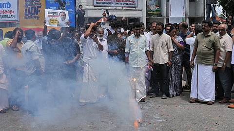 Congress workers burst crackers in front of Indira Bhavan to celebrate the announcement of V D Satheesan as the chief minister on Thursday.