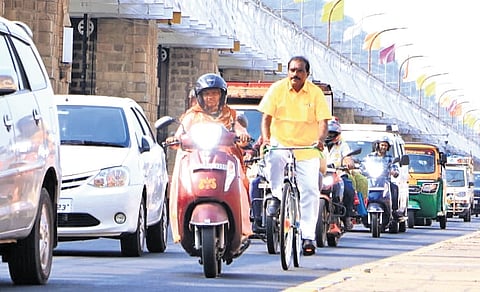 Water Resources Minister Nimmala Ramanaidu pedals his way to CM’s Camp Office in Undavalli to mark ‘No Vehicle Day’ on Friday | Express