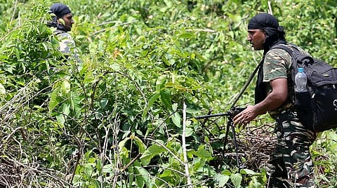 Security personnel patrolling in a forest area in operation against Maoists. 