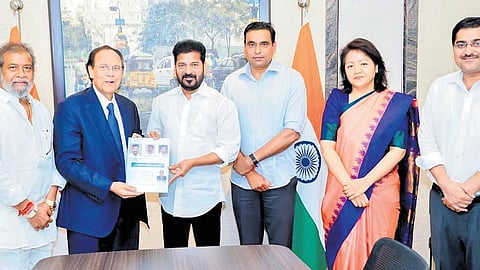 Government adviser and noted oncologist Nori Dattatreyudu presents the ‘Cancer Atlas of Telangana’ to Chief Minister A Revanth Reddy in Hyderabad on Friday.