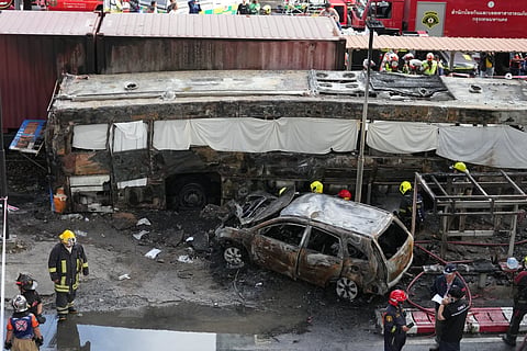 Rescuers work at a train crash site near Makkasan station in Bangkok, Thailand, Saturday, May 16, 2026.