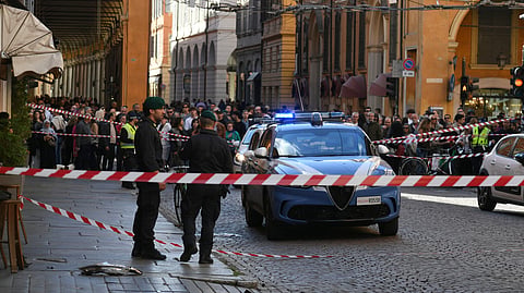 Financial Police patrol a scene after a car incident in a street in Modena, Italy, Saturday, May 16, 2026. 