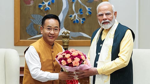 Sikkim Chief Minister Prem Singh Tamang (L) with Prime Minister Narendra Modi.