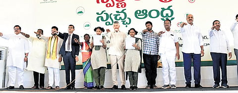 Chief Minister Nara Chandrababu Naidu administering the cleanliness pledge during the Swarna Andhra - Swachh Andhra programme at Narasannapeta in Srikakulam district on Saturday.