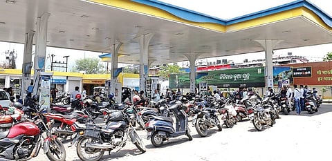 Two-wheelers lined up at a closed filling station in Bhubaneswar 