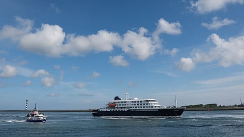 The MV Hondius ship is escorted into the Port of Rotterdam, Netherlands, Monday, May 18, 2026.
