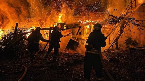 Ukrainian Emergency Services on Wednesday, April 29, 2026, rescue workers put out a fire of a residential building destroyed by a Russian drone strike on Odesa region, Ukraine.