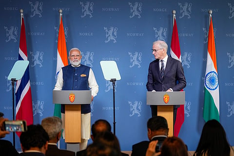 Norwegian Prime Minister Jonas Gahr Støre and India's Prime Minister Narendra Modi, left, hold a press conference after their meeting at the government's representative facility in Oslo, Monday May 18, 2026.