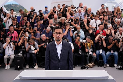 Director Na Hong-jin poses for photographers at the photo call for the film 'Hope' during the 79th international film festival, Cannes, southern France, Monday, May 18, 2026.