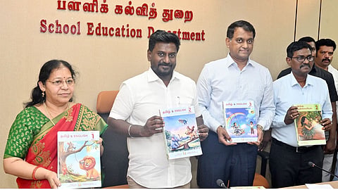 Minister Rajmohan (L) releases textbooks in Chennai on Monday