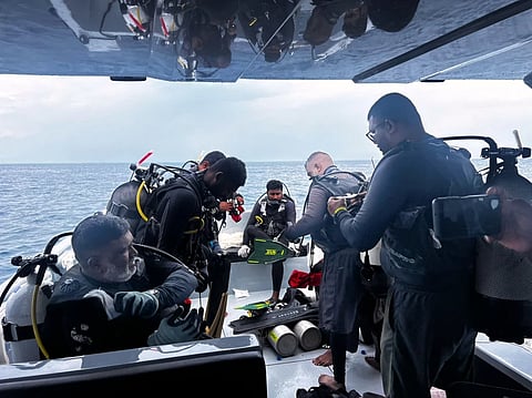 This image released by the Maldives President’s Media Division, shows divers preparing to search for the four missing Italian divers near Alimathaa Island, Vaavu Atoll, Maldives, Saturday, May 15, 2026. 