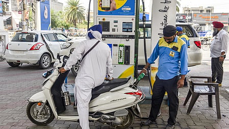 Customers refuel their vehicles at a petrol pump after petrol and diesel prices were hiked in the second increase within a week, in Amritsar on Tuesday, May 19, 2026. 