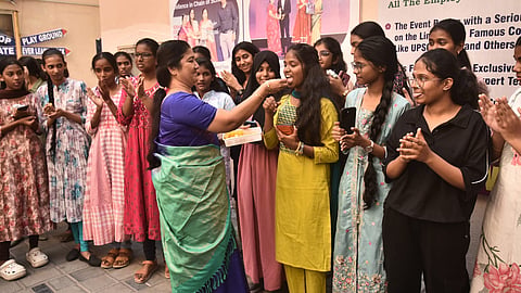 Students and teachers celebrate after the 10th class results at everwin Matriculation Higher Secondary School in Chennai on Wednesday.