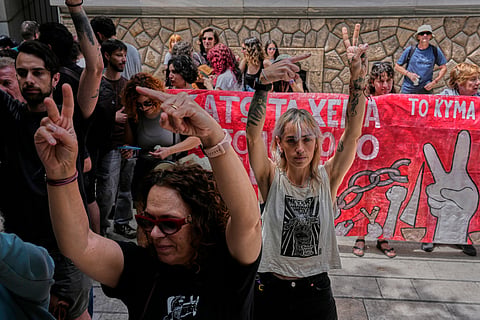 Protesters chant pro-Palestinian slogans outside Greece's Foreign Ministry after Israel's navy intercepted an activist flotilla in waters off of Cyprus, in Athens, Tuesday, May 19, 2026