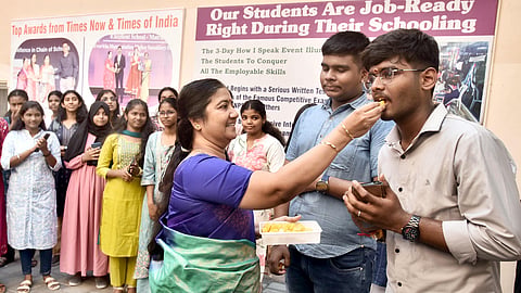 Students and teachers celebrate after the Class 10 results are announced at Everwin Matriculation Higher Secondary School in Chennai on Wednesday.