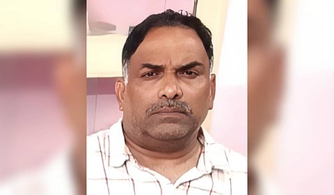 Suspended Sub-Registrar Officer-II Davuluri Anand.