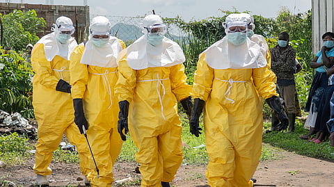 Red Cross workers arrive at a health center, to transport people who died of Ebola, in Rwampara, Congo, Wednesday, May 20, 2026