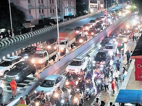 Slow-moving traffic at Shivananda Circle flyover.