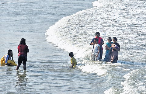 Visitors seeking relief at the shoreline at Kasimedu as Chennai continues to be affected by extreme hot weather conditions