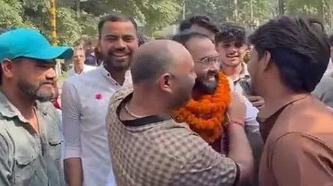 After his release from Dasna jail in Ghaziabad, supporters welcomed him with flower petals and took out a procession.
