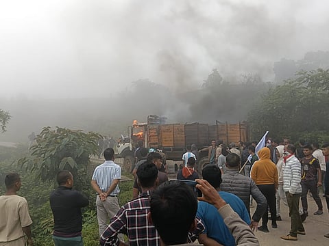 A stationary truck was burned down at a distance by the miscreants.